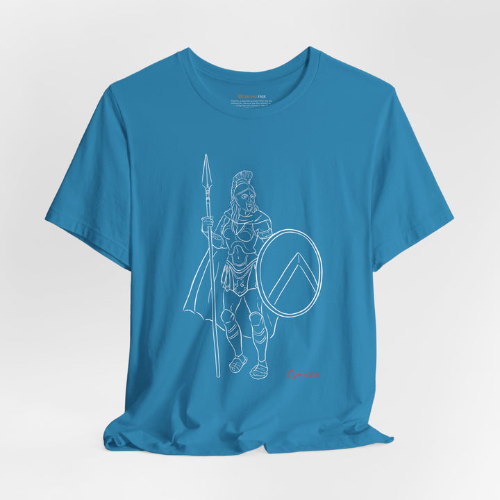 Aqua t-shirt with a white line graphic of Cynisca standing in full Spartan armor, holding a spear and a round shield with a lambda symbol, with the red text 'Cynisca' below the design.