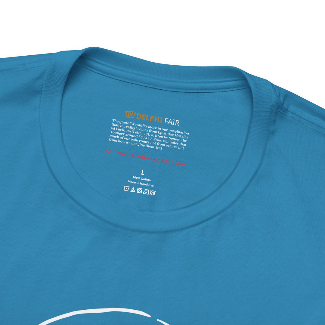 Close-up of a aqua t-shirt neck label featuring the phrase 'We suffer more in imagination than in reality,' with a note about its meaning and origin from Seneca's letters written around 63 AD."
