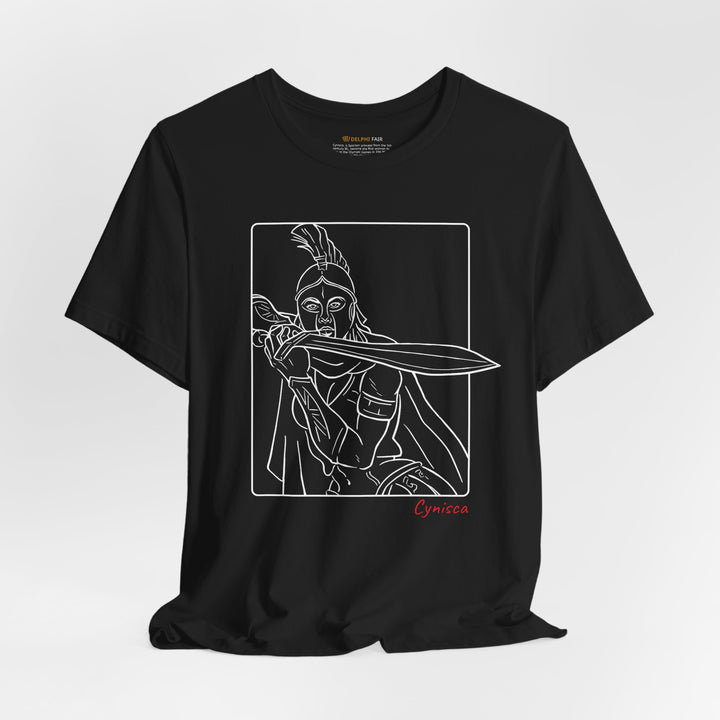 Black t-shirt with a white line graphic of Cynisca in a dramatic close-up pose, holding a sword across her chest inside a rectangular frame, with the red text 'Cynisca' below the design.