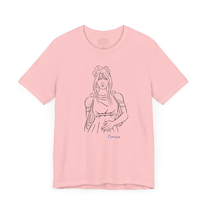 Pink t-shirt with a black line graphic of Cynisca in ancient-style casual clothing, with flowing hair and a calm expression, and the blue text 'Cynisca' below the design.