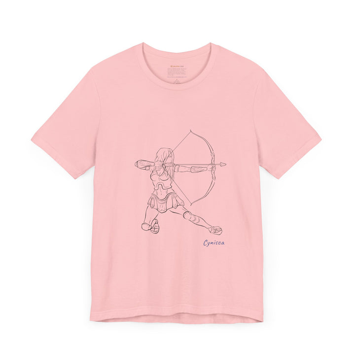 Pink t-shirt with a black line graphic of Cynisca in armor kneeling and drawing a bow, aiming an arrow forward, with the blue text 'Cynisca' below the design.