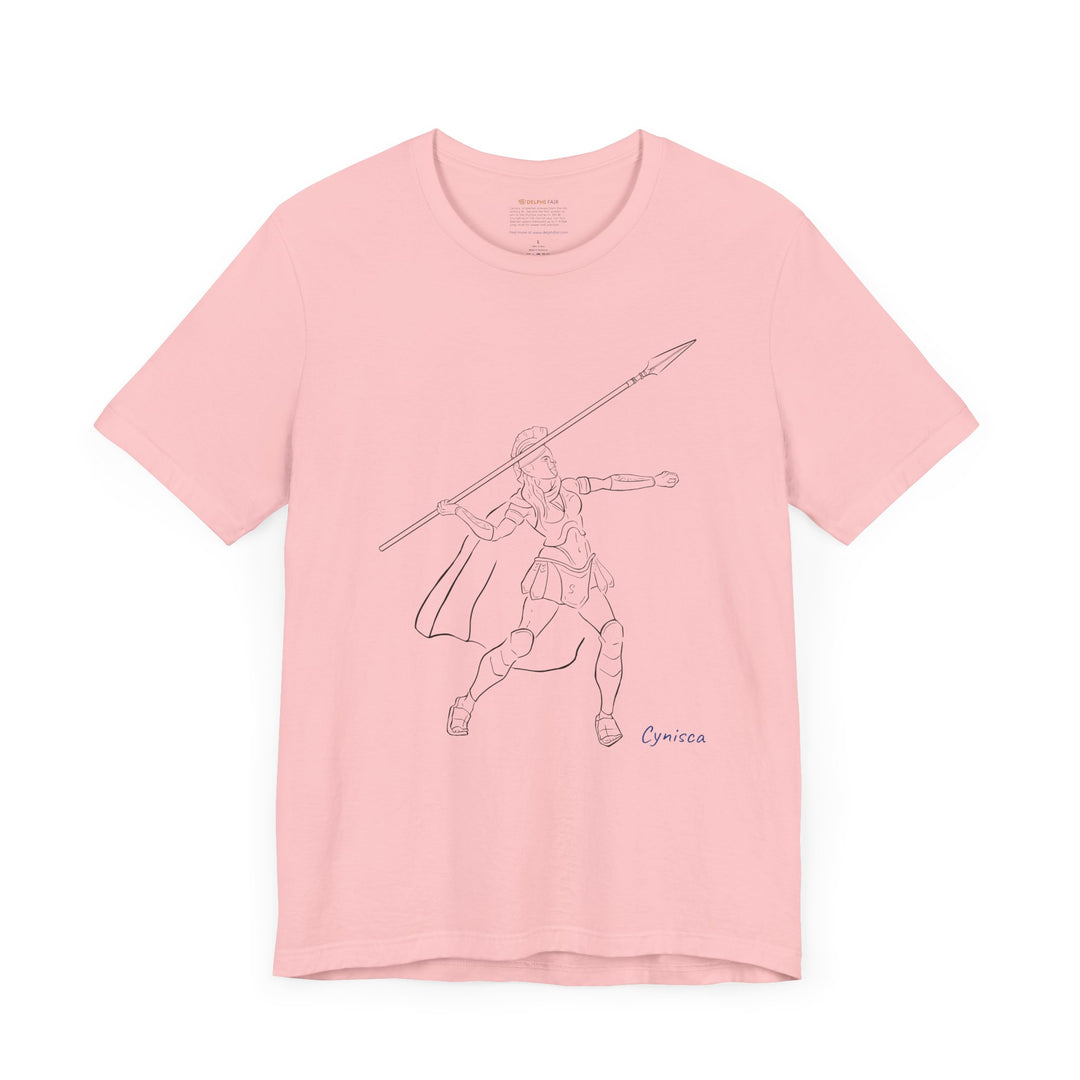 Pink t-shirt with a black line graphic of Cynisca in Spartan armor mid-action, throwing a spear with an extended arm, and the blue text 'Cynisca' below the design.