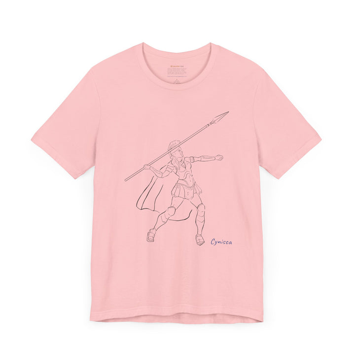 Pink t-shirt with a black line graphic of Cynisca in Spartan armor mid-action, throwing a spear with an extended arm, and the blue text 'Cynisca' below the design.