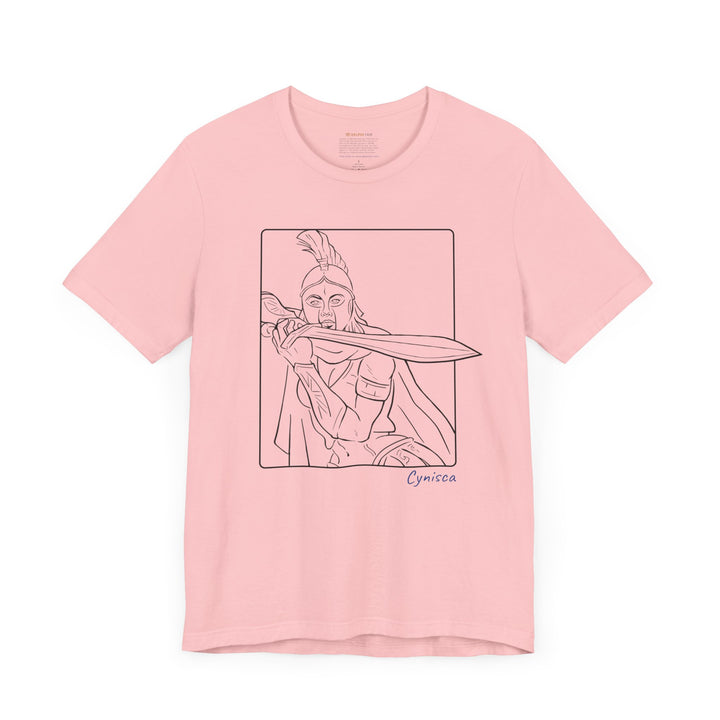 Dark-pink t-shirt with a black line graphic of Cynisca in a dramatic close-up pose, holding a sword across her chest inside a rectangular frame, with the blue text 'Cynisca' below the design.