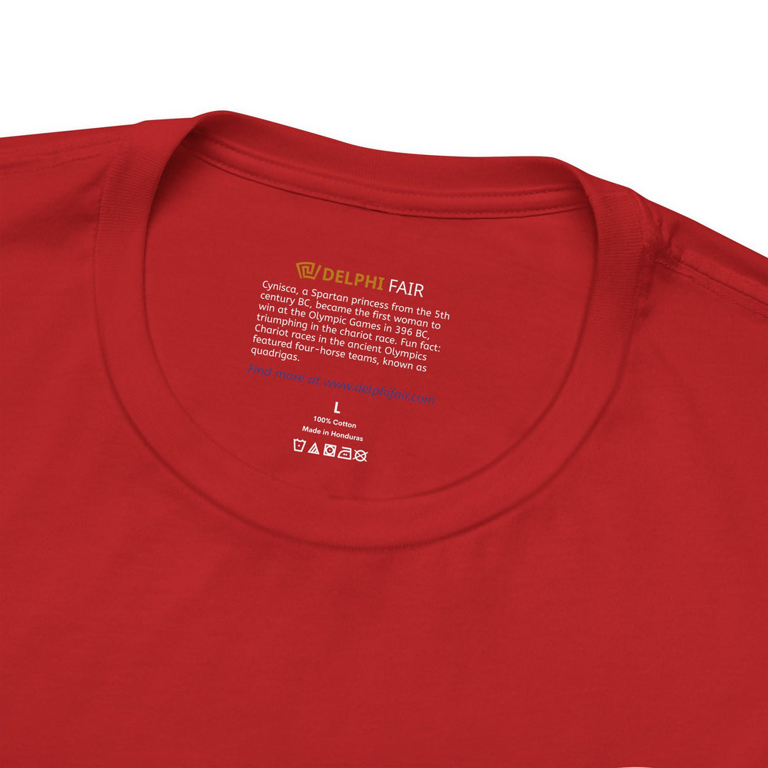 Close-up of a red t-shirt neck label with the text about Cynisca, a 5th-century BC Spartan princess and the first woman to win at the Olympic Games, including a fun fact about quadriga chariot races.