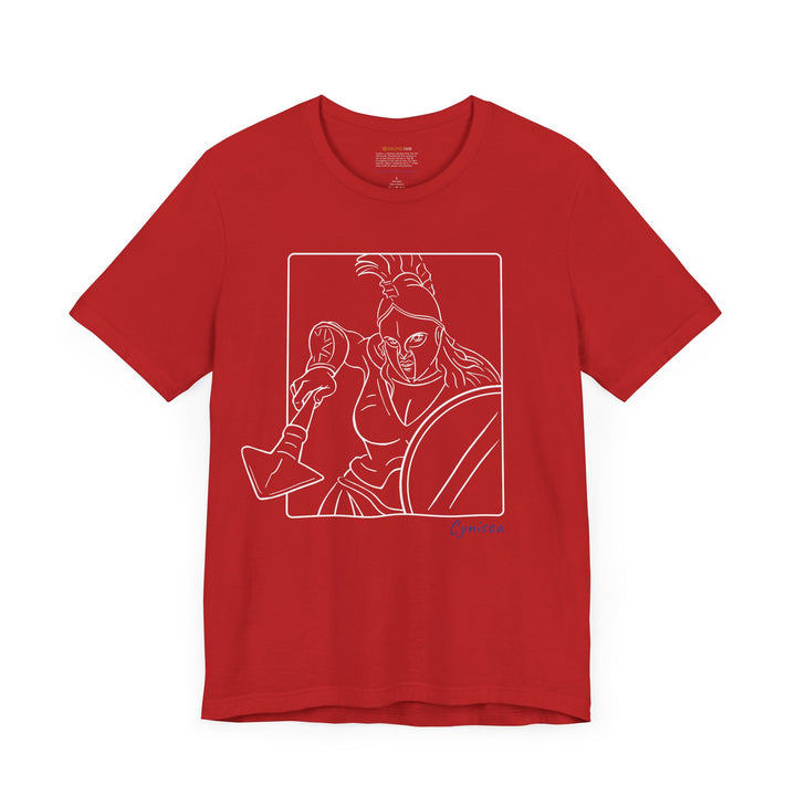 Red t-shirt with a white line graphic of Cynisca in a dynamic close-up pose, wearing a helmet and holding spear and shield inside a rectangular frame, with the blue text 'Cynisca' below the design.