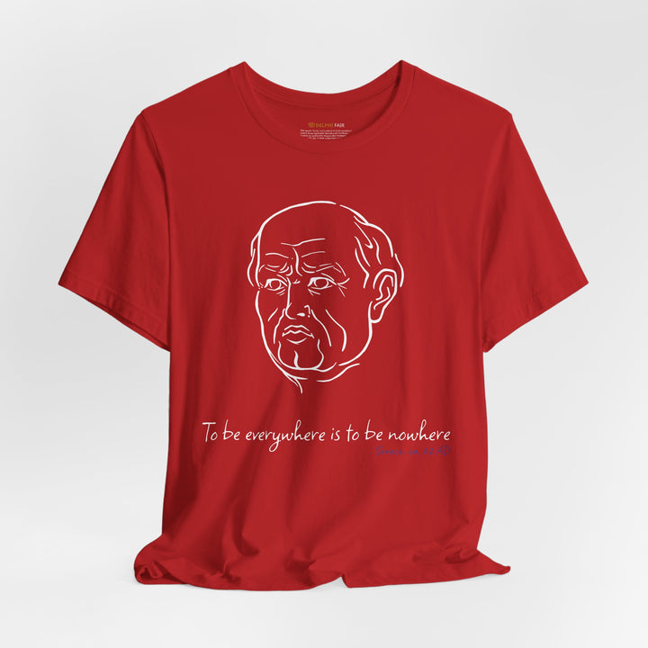 Red t-shirt with a white graphic of Senecas' head, the quote 'To be everywhere is to be nowhere' and the blue text 'Seneca, ca. 62 AD' below