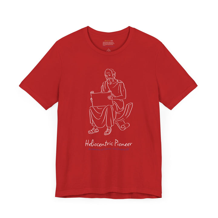 A red t-shirt featuring a white graphic of Aristarchus sitting and reading a scroll, with the text 'Heliocentric Pioneer' and the blue text 'Aristarchus of Samos, 3rd Century BC' below.