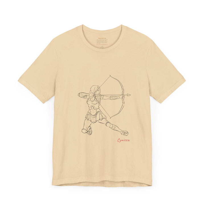 Soft-cream t-shirt with a black line graphic of Cynisca in armor kneeling and drawing a bow, aiming an arrow forward, with the red text 'Cynisca' below the design.