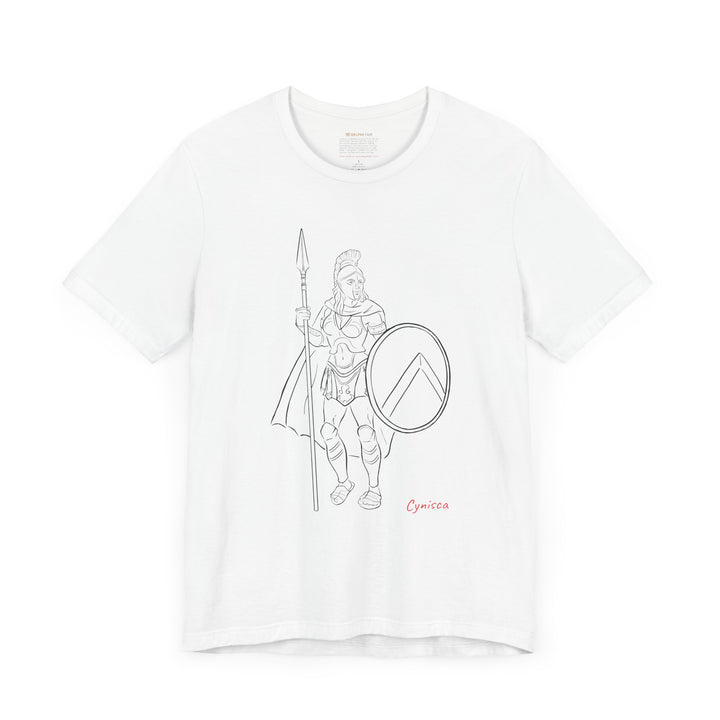 White t-shirt with a black line graphic of Cynisca standing in full Spartan armor, holding a spear and a round shield with a lambda symbol, with the red text 'Cynisca' below the design.