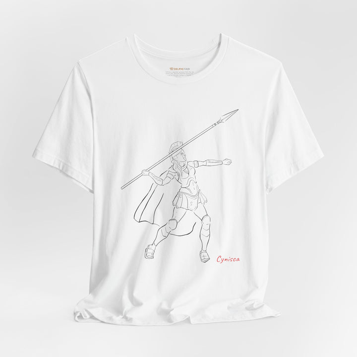 White t-shirt with a black line graphic of Cynisca in Spartan armor mid-action, throwing a spear with an extended arm, and the red text 'Cynisca' below the design.