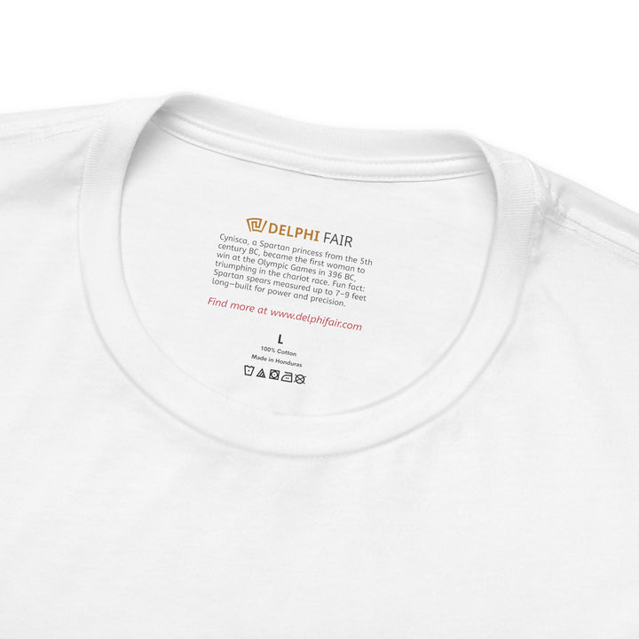 Close-up of a white t-shirt neck label with the text about Cynisca, Olympic champion from ancient Sparta, and a fun fact about Spartan spears measuring up to 7–9 feet long.