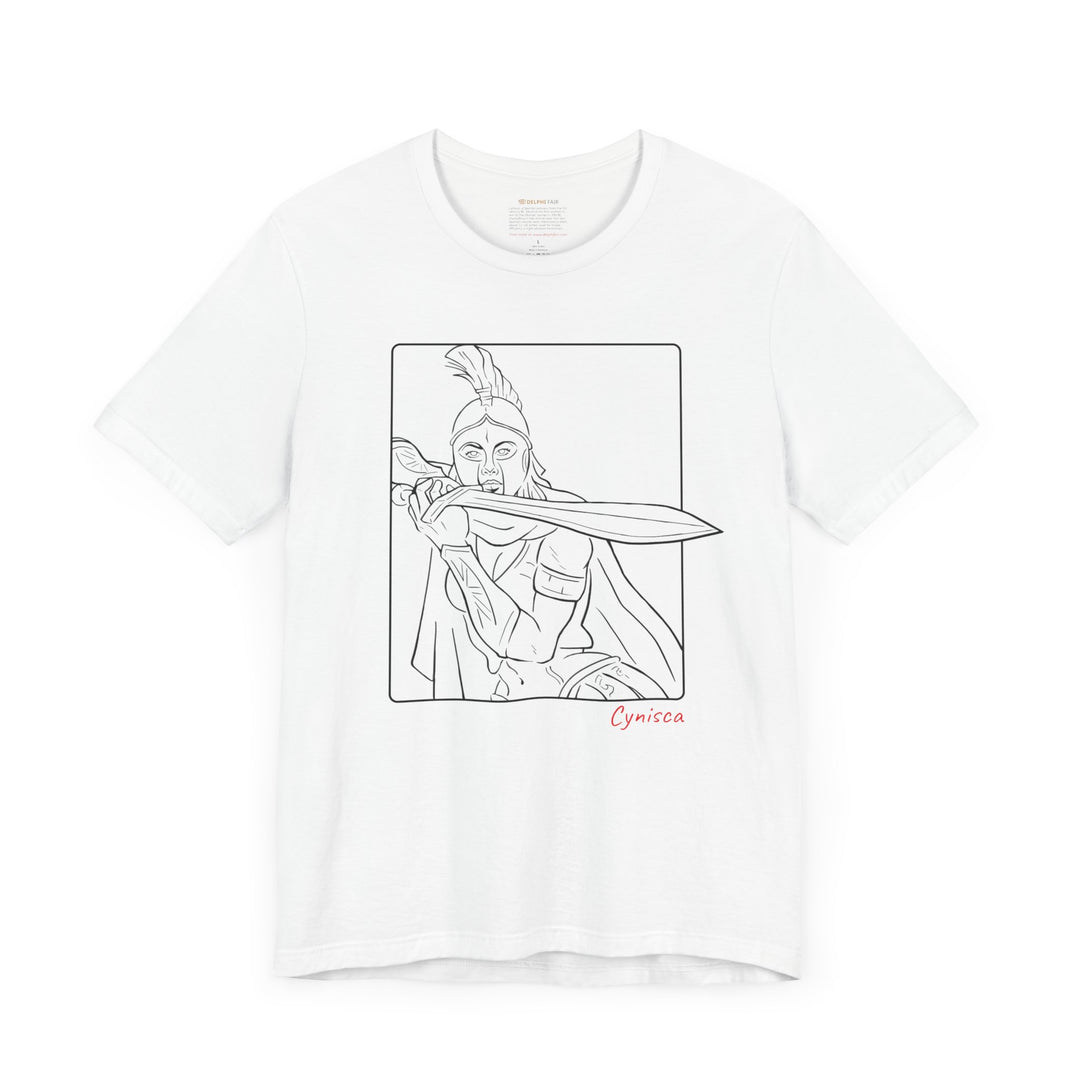 White t-shirt with a black line graphic of Cynisca in a dramatic close-up pose, holding a sword across her chest inside a rectangular frame, with the red text 'Cynisca' below the design.