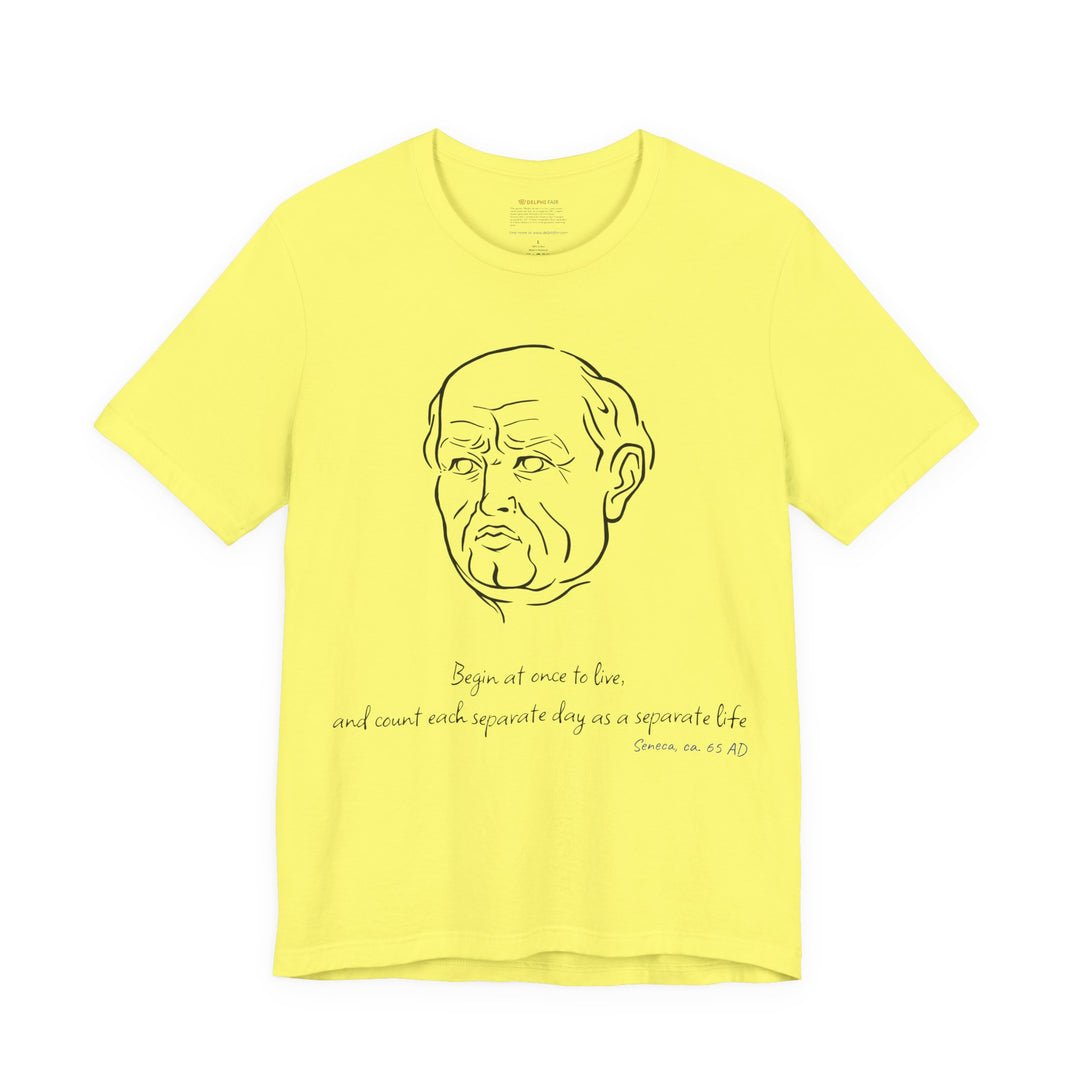 Yellow t-shirt with a black graphic of Senecas' head, the quote 'Begin at once to live, and count each separate day as a separate life' and the blue text 'Seneca, ca. 65 AD' below
