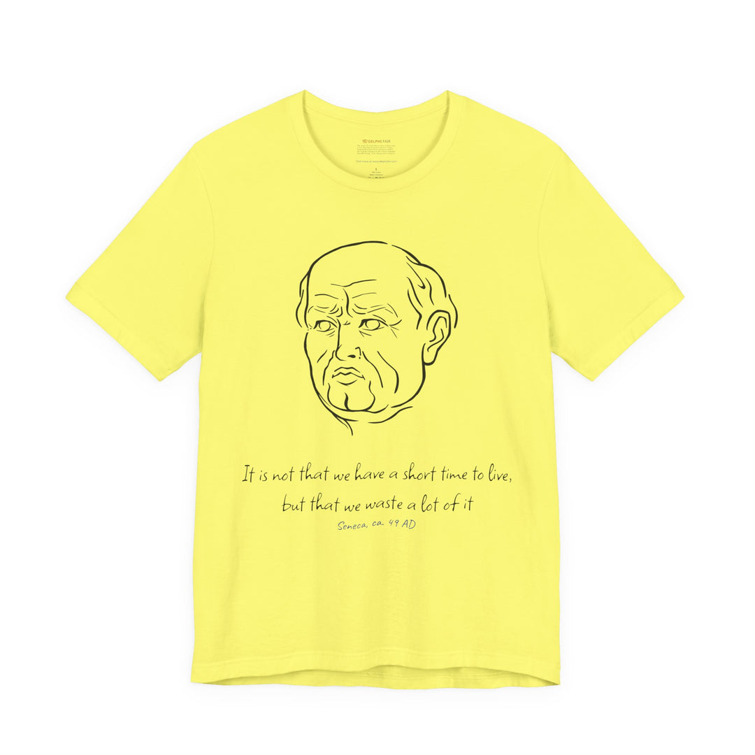 Yellow t-shirt with a black graphic of Senecas' head, the quote 'It is not that we have a short time to live, but that we waste a lot of it' and the blue text 'Seneca, ca. 49 AD' below