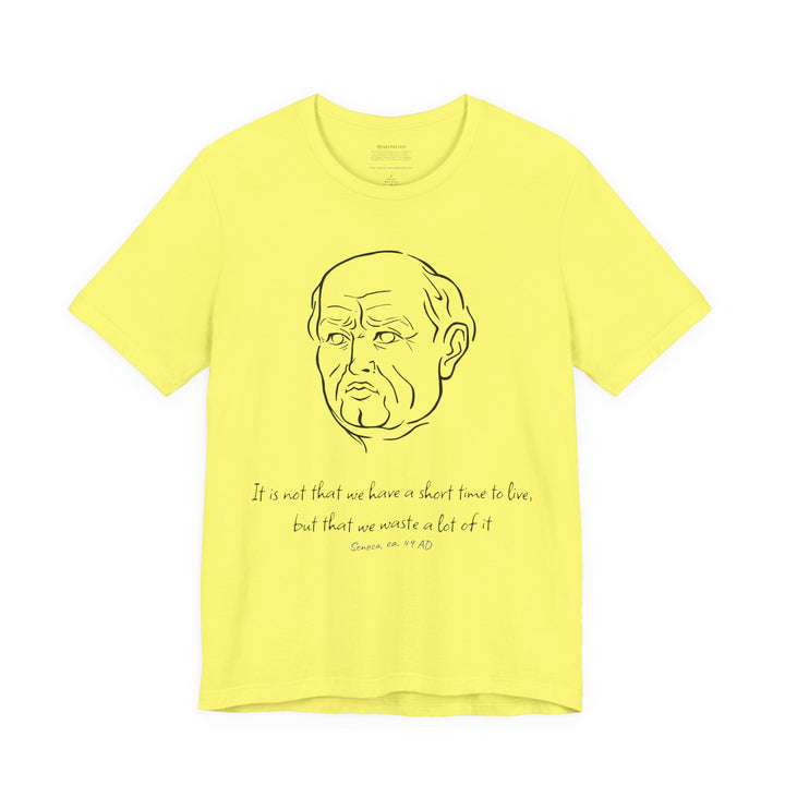 Yellow t-shirt with a black graphic of Senecas' head, the quote 'It is not that we have a short time to live, but that we waste a lot of it' and the blue text 'Seneca, ca. 49 AD' below